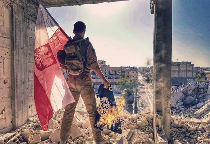 Polish soldier burns ISIS flag